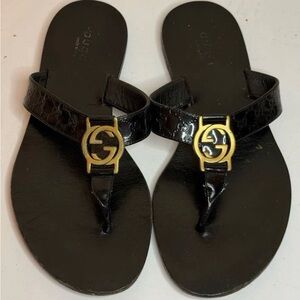 Authentic. Gucci Black Leather Flip Flops with Gold Emblem